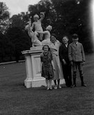David with three friends by
                cherub sculpture in Chiswick gardens