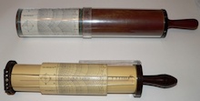 The Whythe-Fuller slide rule, prototype at
                top, commercial version below