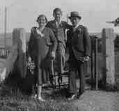David with his Mum &
                Dad posing for a photo on a stile in the countryside